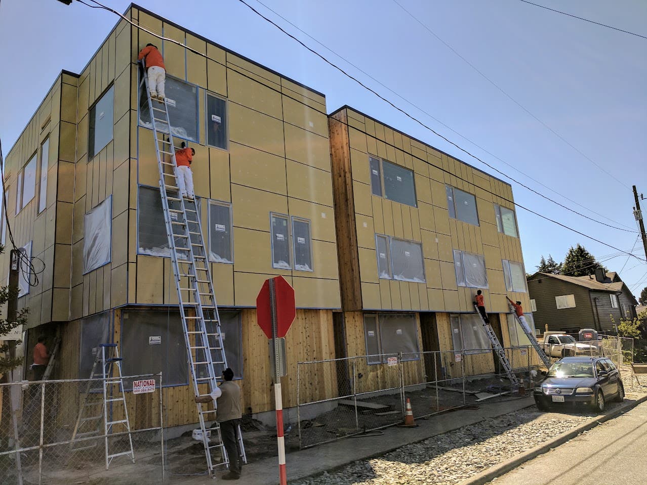 Alltech Painting crew applying exterior coatings on a new construction project in Lynnwood