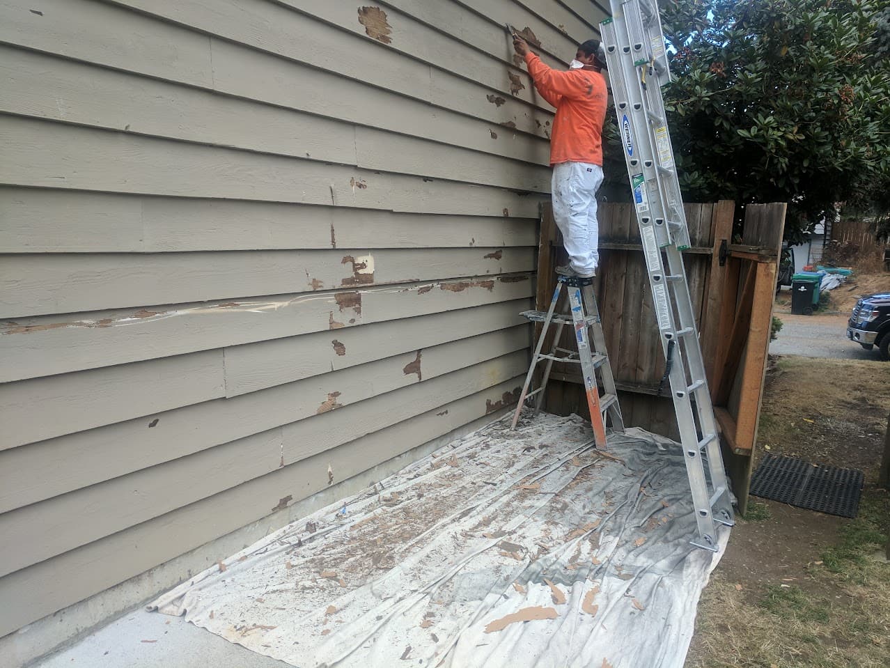 Alltech Painting crew preparing a Shoreline exterior before painting